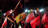 اهتزاز پرچم عزای حسینی در کنار پرچم ایران درسنگر خیابان